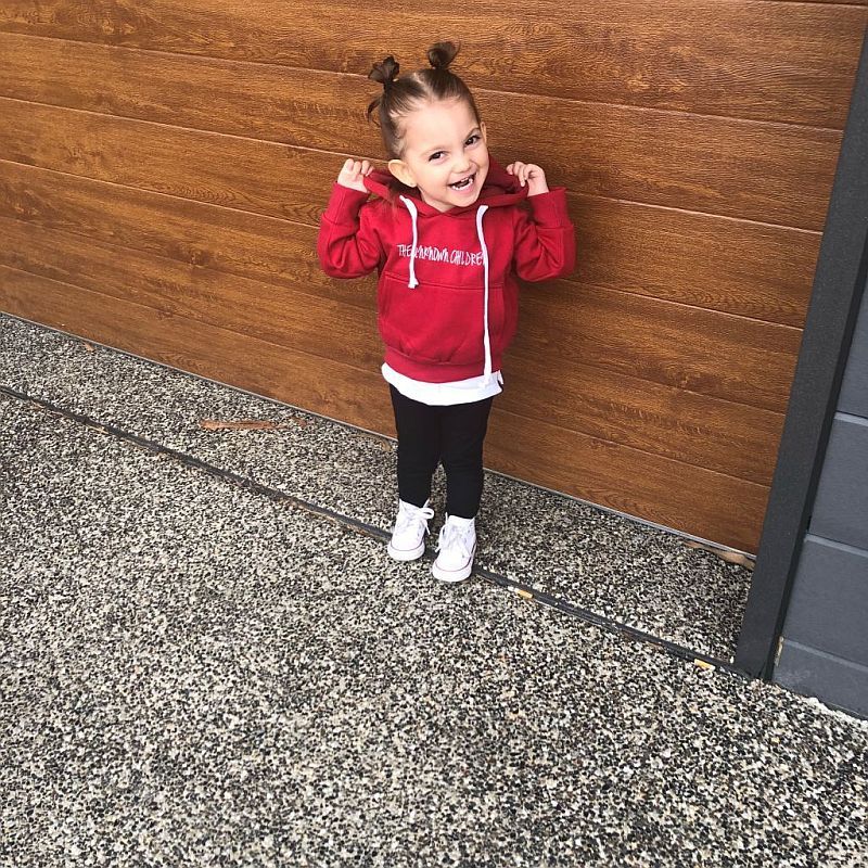 A cheerful young child wearing THE UNKNOWN CHILDREN 'Originals' "Always Look Up" red hoodie poses with a big smile.
This limited-edition, unisex hoodie made from 100% superior cotton is designed for both boys and girls,
offering a stylish and comfortable look. Perfect for trendy children's fashion.