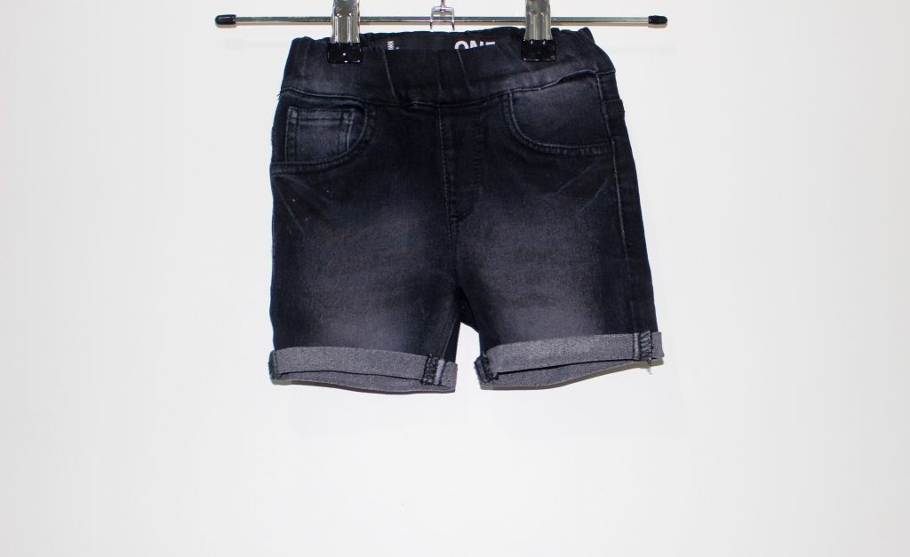 Black rolled hem denim shorts which offer a casual and stylish look for active play or everyday wear.