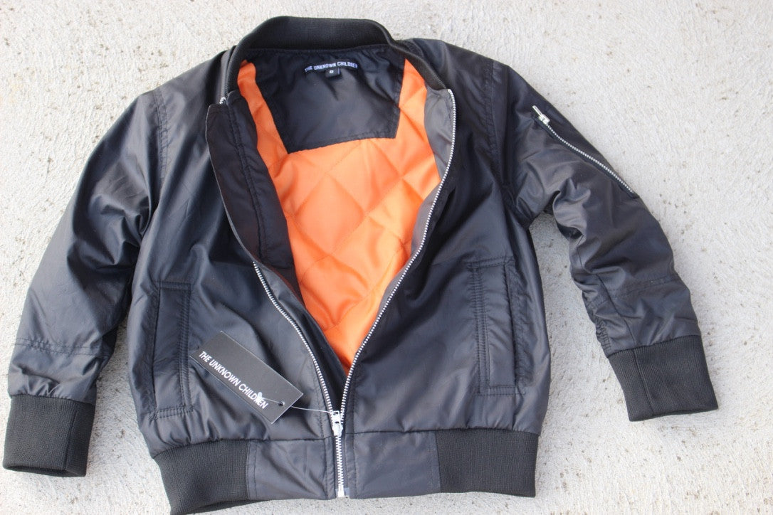 A stylish, eco-friendly bomber jacket in black, designed for both boys and girls.